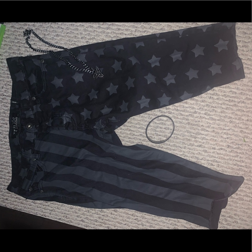 Black shorts, wrist band and necklace